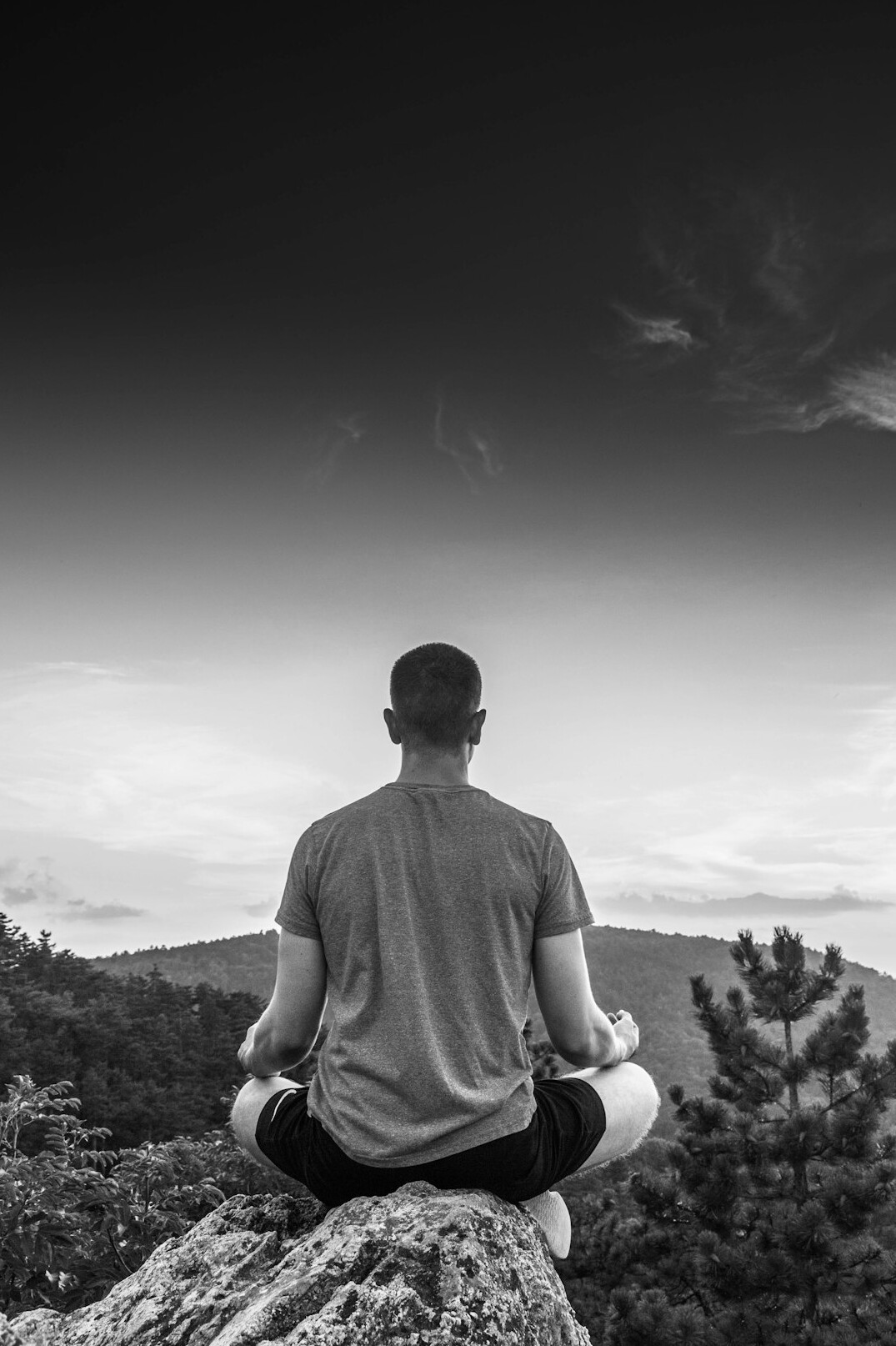 person meditating in nature
