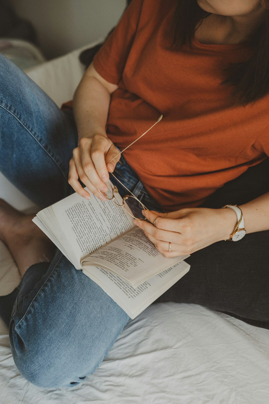 person reading book at home