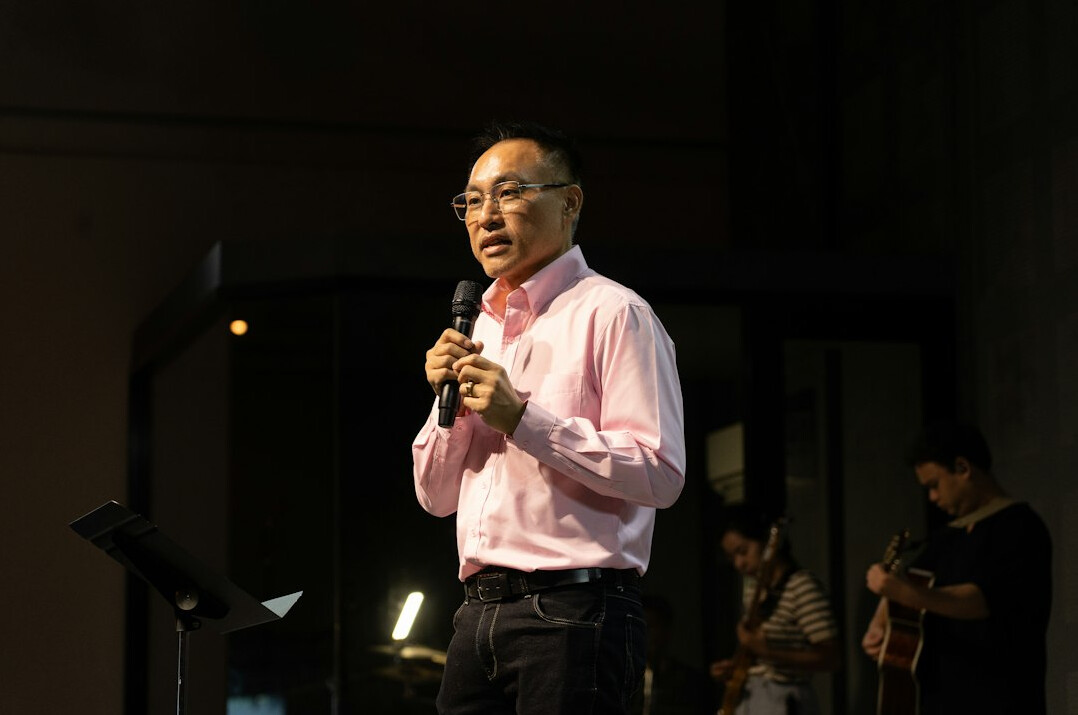 confident speaker on stage